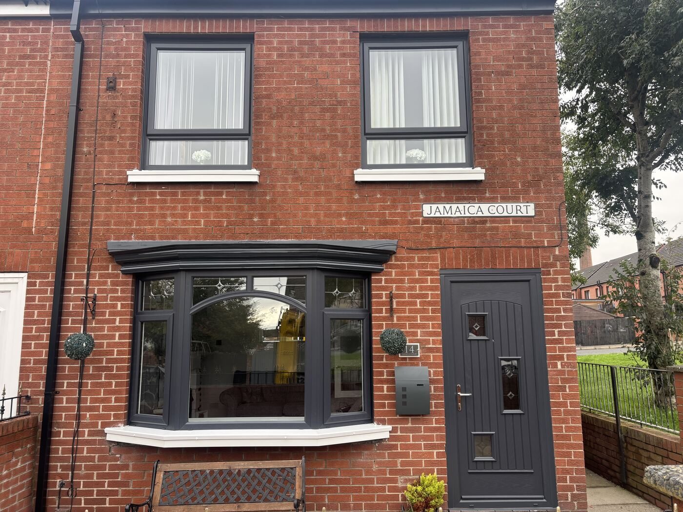 Anthracite grey door on a red brick house